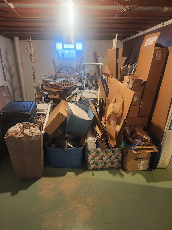 Roll-off dumpster container at job site for 2 Yard Dumpster Rental in Timber Pines